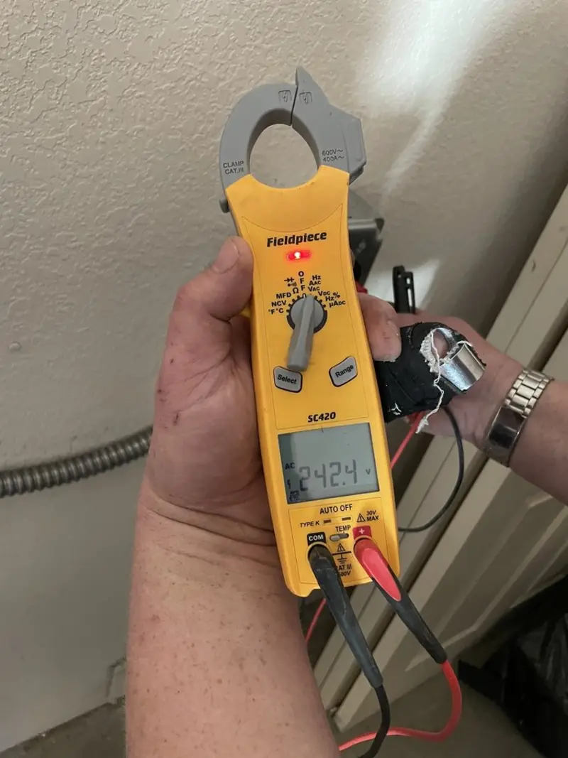 Voltage testing with clamp meter during Outlet Installation in North College Hill